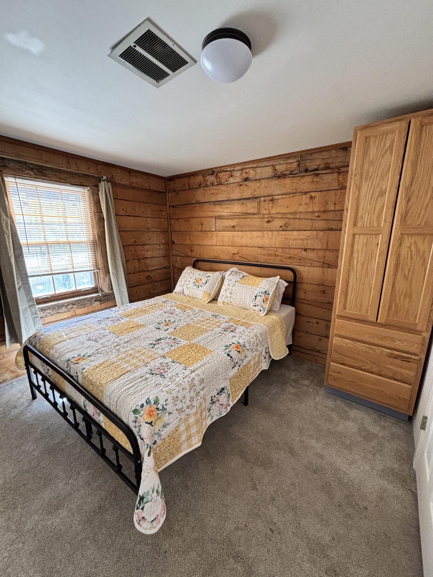 Bedroom with yellow quilt