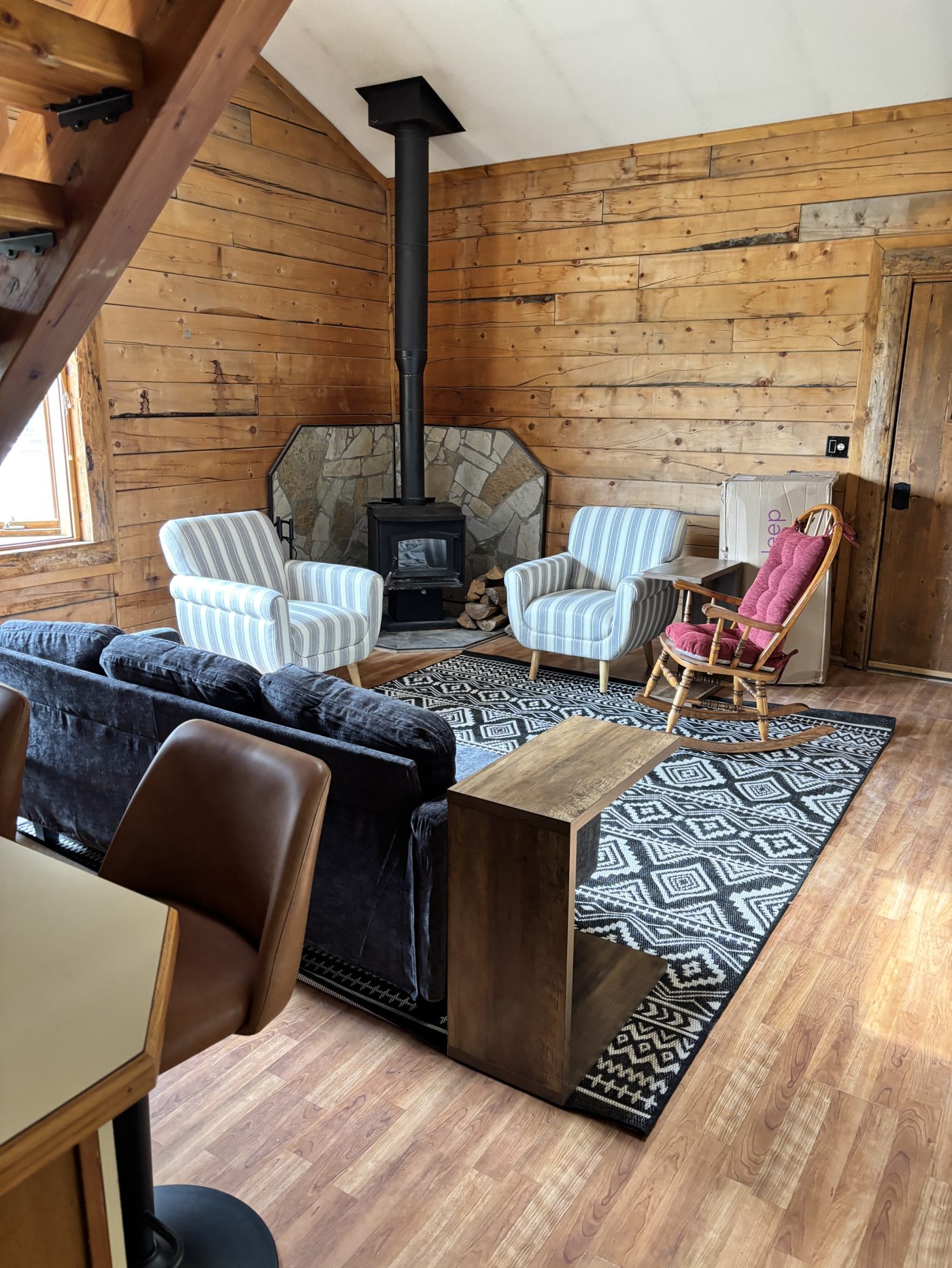 Living room with sofa and wood stove